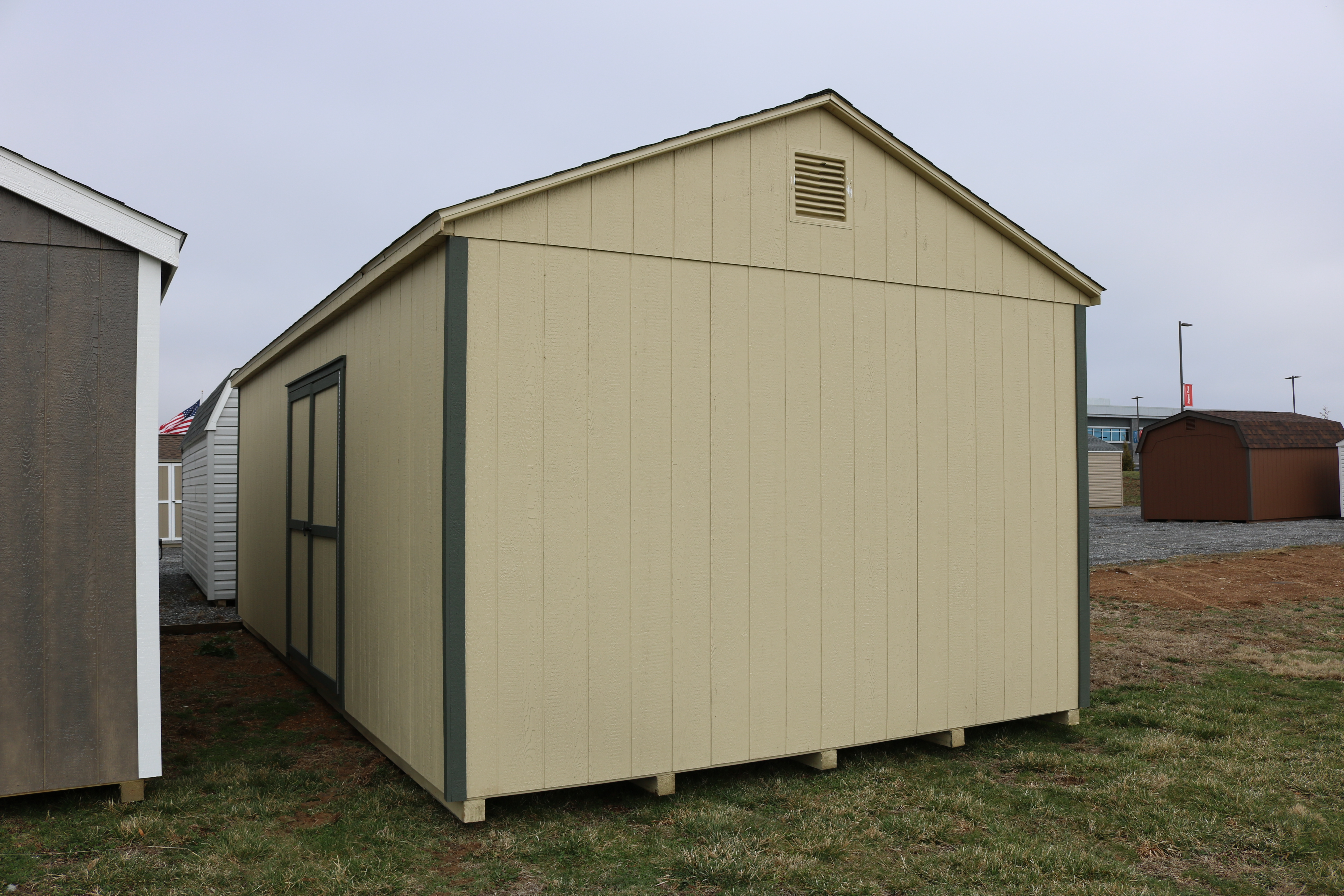 Pine Creek 12x24 HD Peak Barn with Beige walls, Avocado trim, and Weatherwood shingles