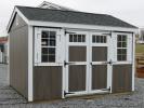 Pine Creek 10x12 HD New England Peak with Driftwood Polyurethane walls, White shutters White trim, and Charcoal shingles